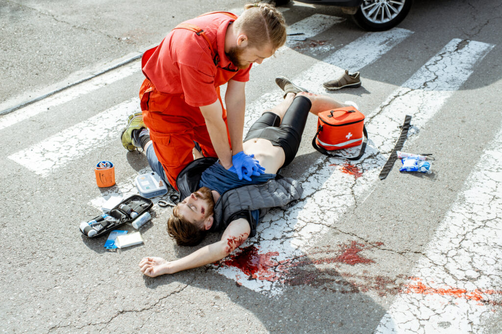Medic applying emergency care after the motorcycle accident