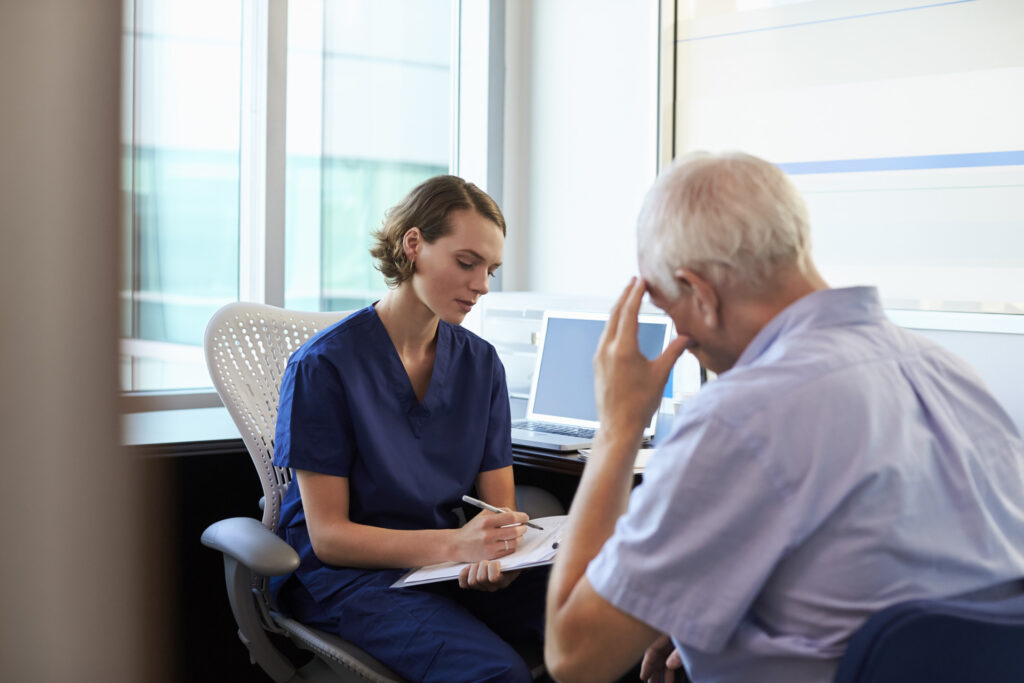 doctor in consultation with depressed male
